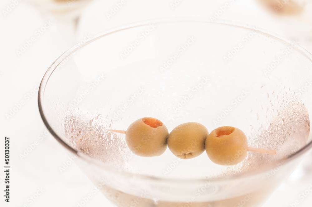 Dry Martini Cocktail with olives extreme close up Dry Martini Cocktail with olives extreme close up