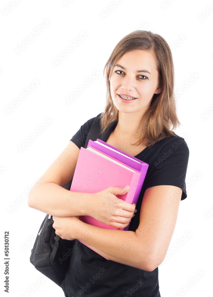 Smiling attractive female student with backpack holding books Smiling attractive female student with backpack holding books