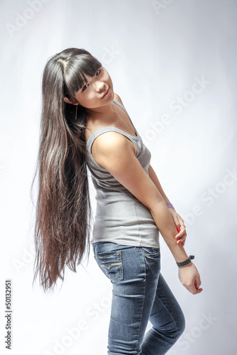 back view of standing young beautiful Asian woman