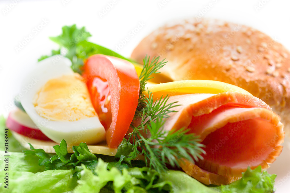 sandwich with ham,cheese, fresh vegetables and egg
