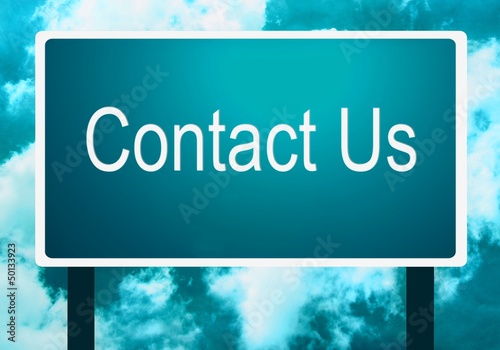 Background of a contact us sign guidepost and the sky