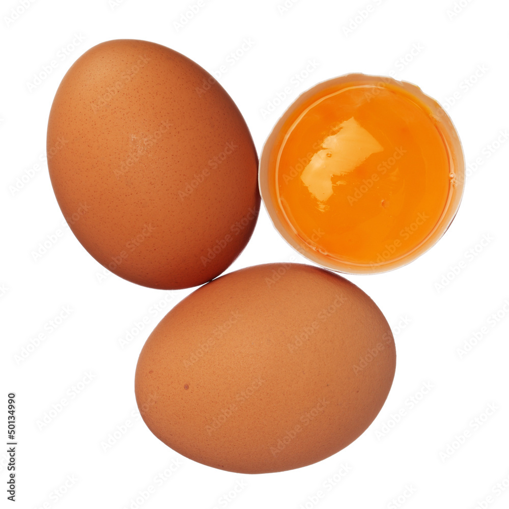 Whole eggs and egg yolk in shell isolated on white Whole eggs and egg yolk in shell isolated on white