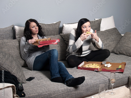 Girlfiriends eating pizza