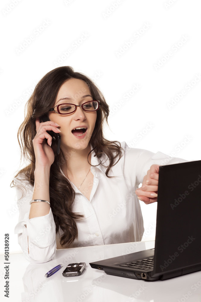 nice and smiling secretary chattering on the phone and looking a nice and smiling secretary chattering on the phone and looking a