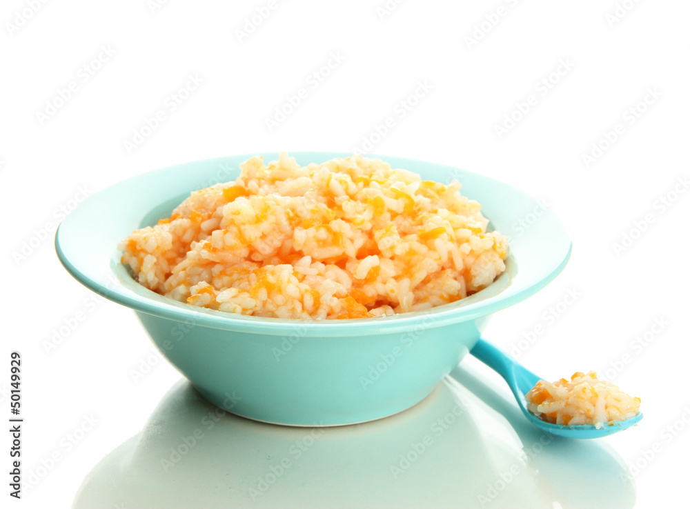 Taste rice porridge with pumpkin in blue bowl, isolated Taste rice porridge with pumpkin in blue bowl, isolated