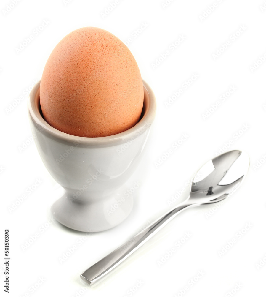 Whole boiled egg in egg cup, isolated on white Whole boiled egg in egg cup, isolated on white