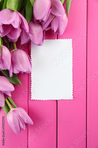 Fototapeta Naklejka Na Ścianę i Meble -  Beautiful bouquet of purple tulips and blank card