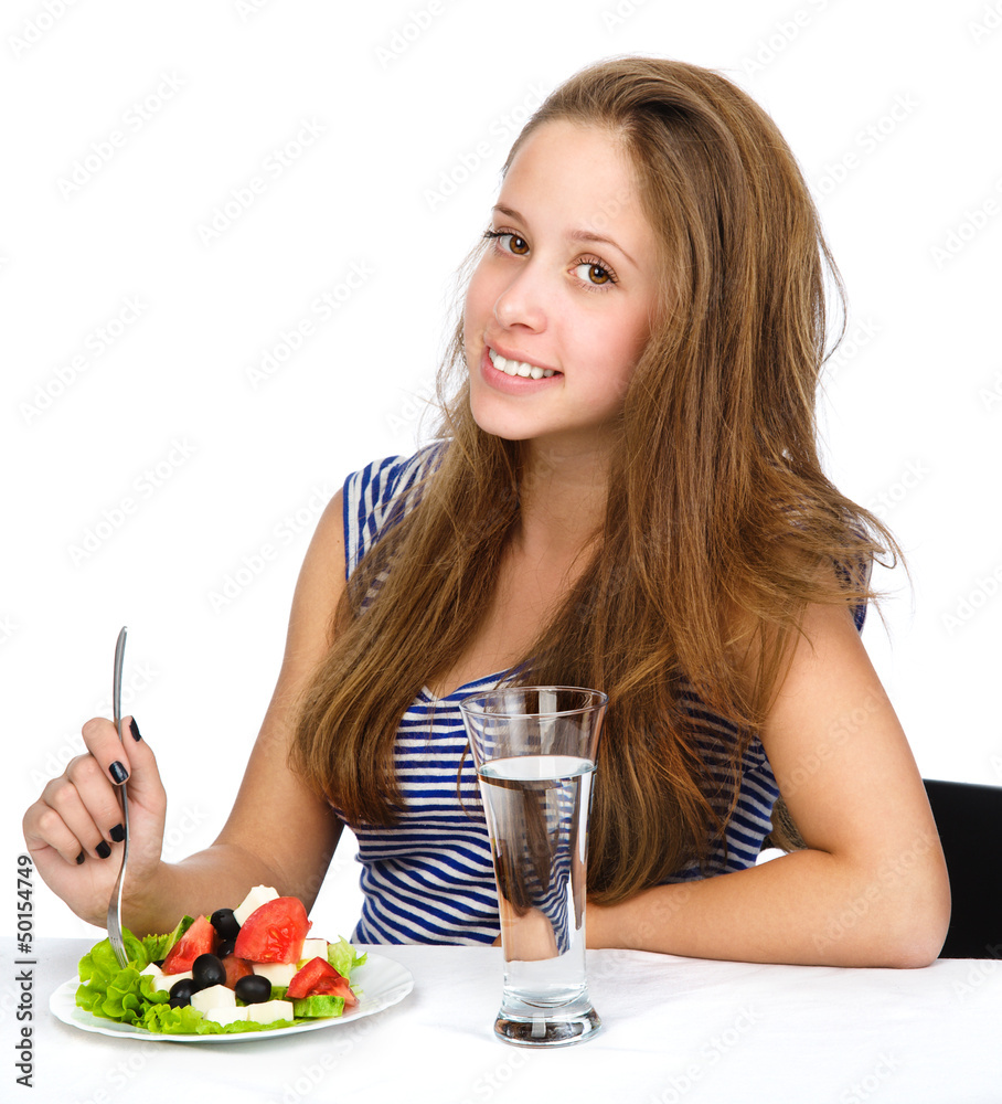 Young Girl Eating Vegetable Salad. isolated Young Girl Eating Vegetable Salad. isolated