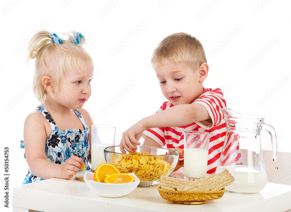Kids having a healthy breakfast. isolated on white Kids having a healthy breakfast. isolated on white