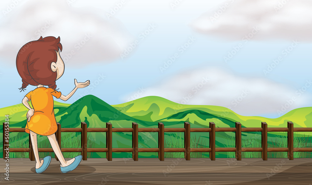 Fototapeta premium A girl looking at the mountain scenery