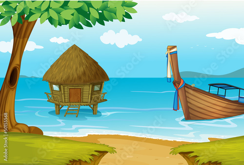A beach with a cottage and a wooden boat
