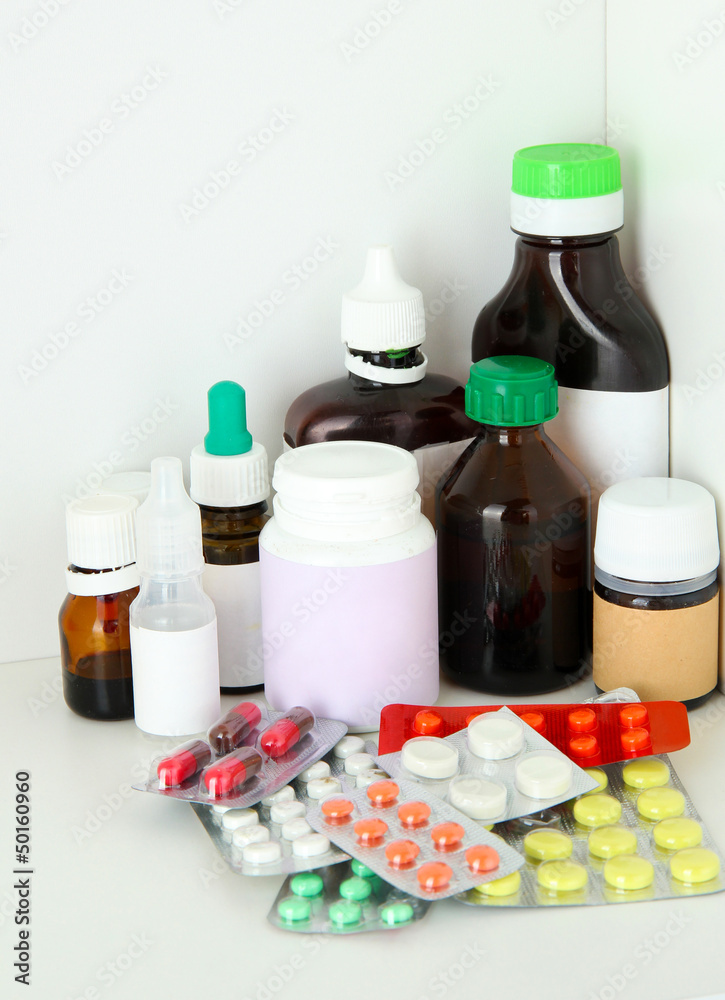 Medical bottles and pills on shelf Medical bottles and pills on shelf