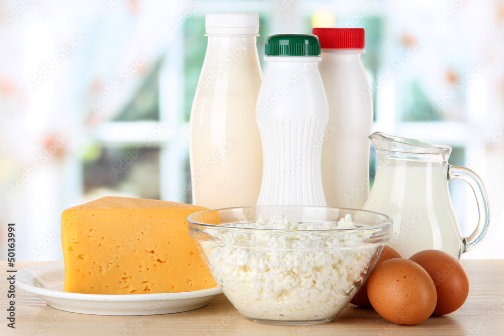 Dairy products and eggs on table in kitchen Dairy products and eggs on table in kitchen