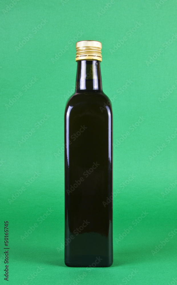 Fototapeta premium OLIVE OIL WITH OLDEN CAP