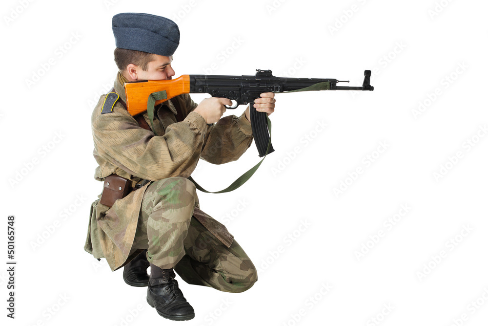 Soldier with submachine gun. Isolated on white background Soldier with submachine gun. Isolated on white background