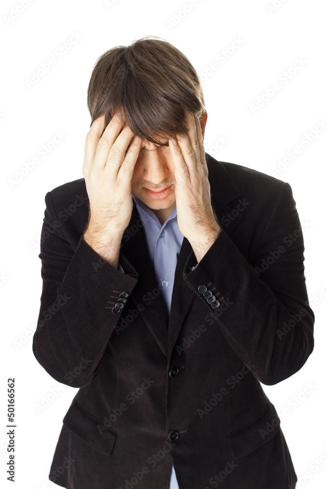 Young businessman covering his face with his hands isolated on w Young businessman covering his face with his hands isolated on w