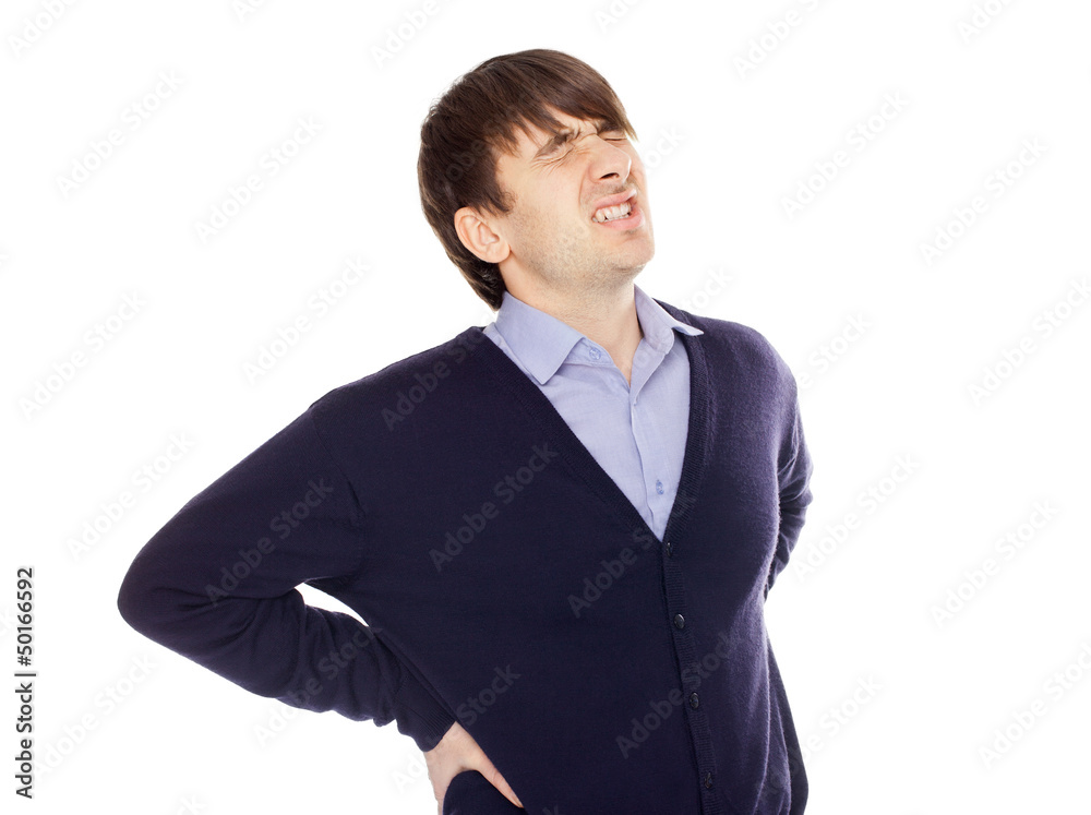 Young man with a backache isolated on white Young man with a backache isolated on white