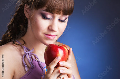 beautiful young woman with red apple