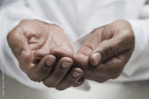 Close up of mixed race man's hands