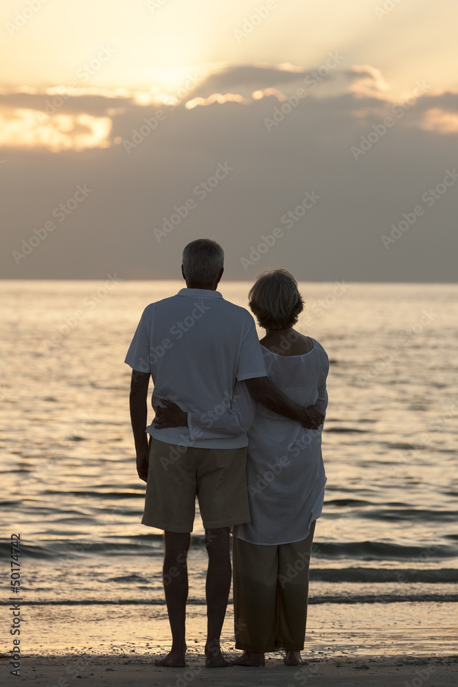 Senior Couple Embracing Sunset Tropical Beach
