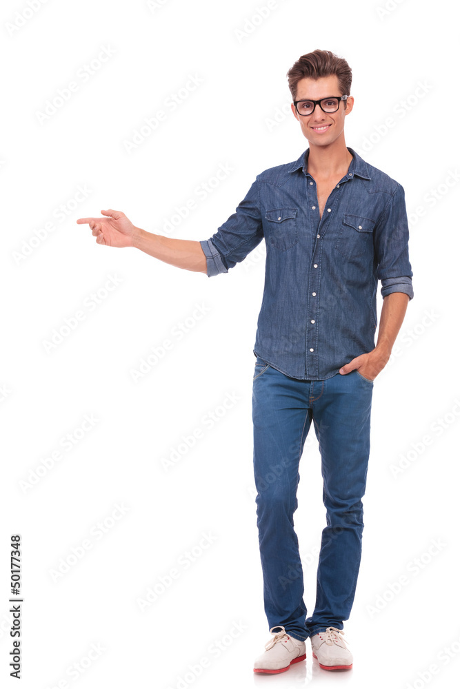 man pointing to side & hand in pocket man pointing to side & hand in pocket