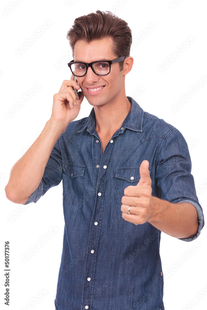 man on the phone shows thumb up