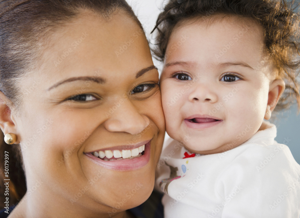 Smiling mixed race mother and baby Smiling mixed race mother and baby