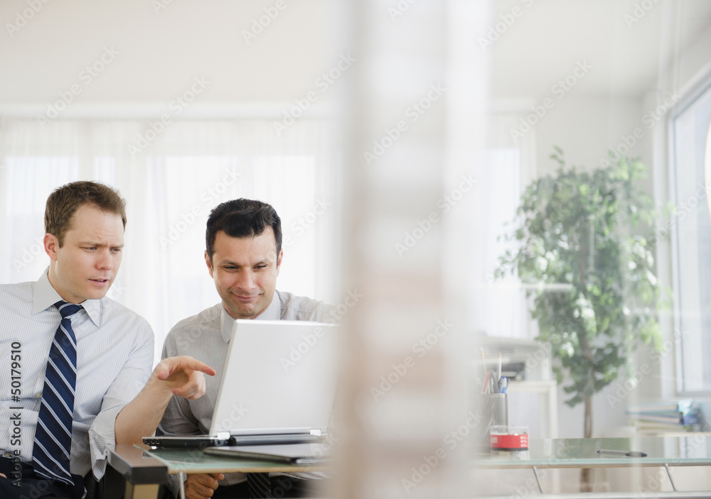Businessmen working together in office