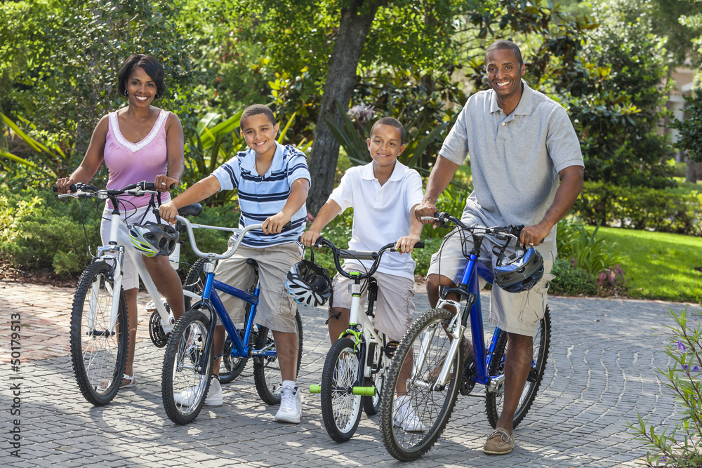 African American Parents Boy Children Riding Bikes