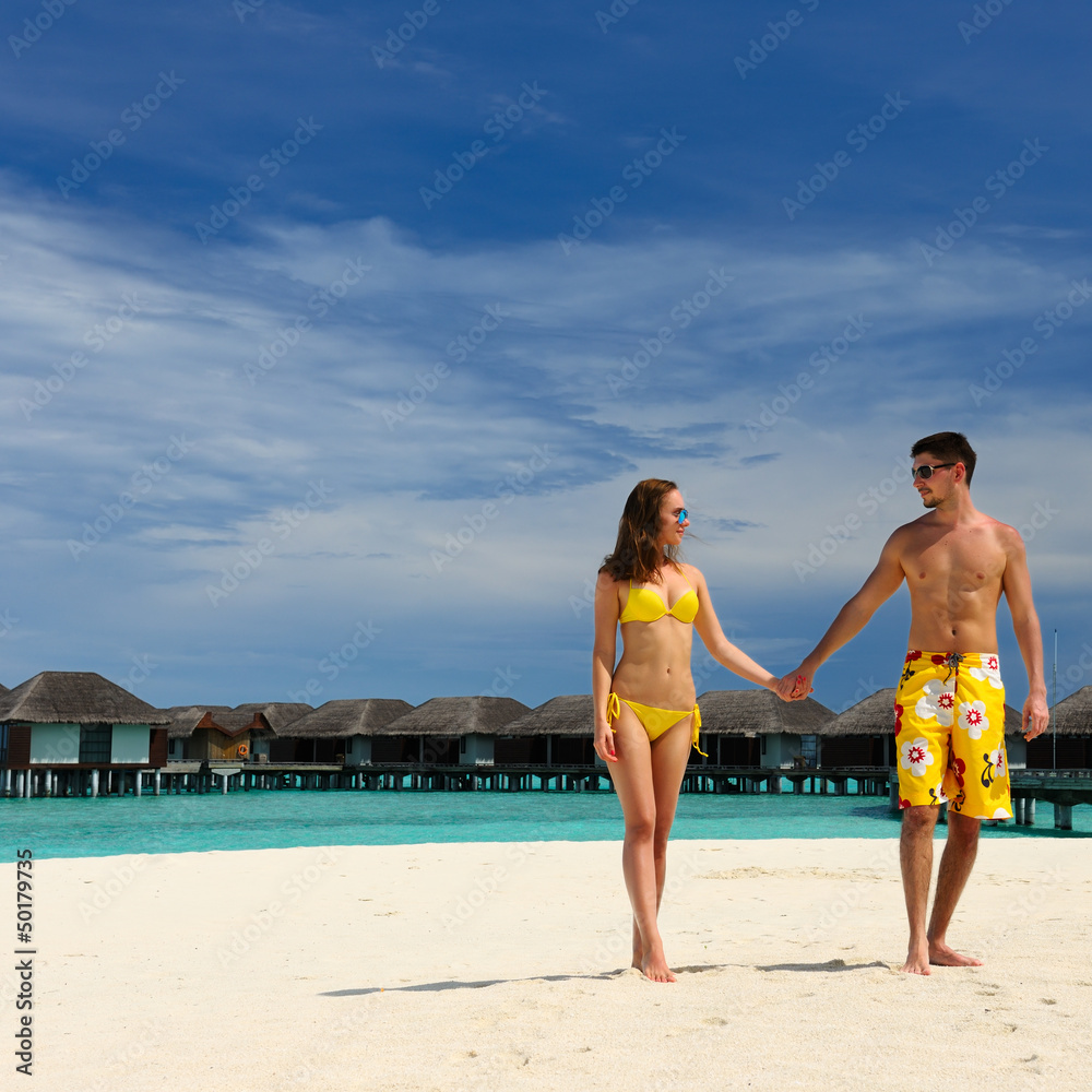Fototapeta premium Couple on a beach at Maldives