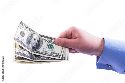 Young successful businessman holding a stack of money