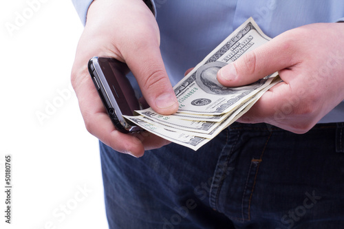 Businessman holding a stack of dollars