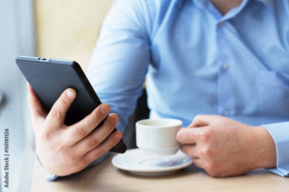 Businessman relaxing during coffee break at workplace Businessman relaxing during coffee break at workplace