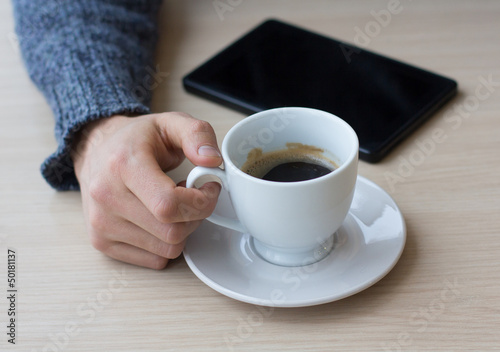 Businessman relaxing during coffee break at workplace