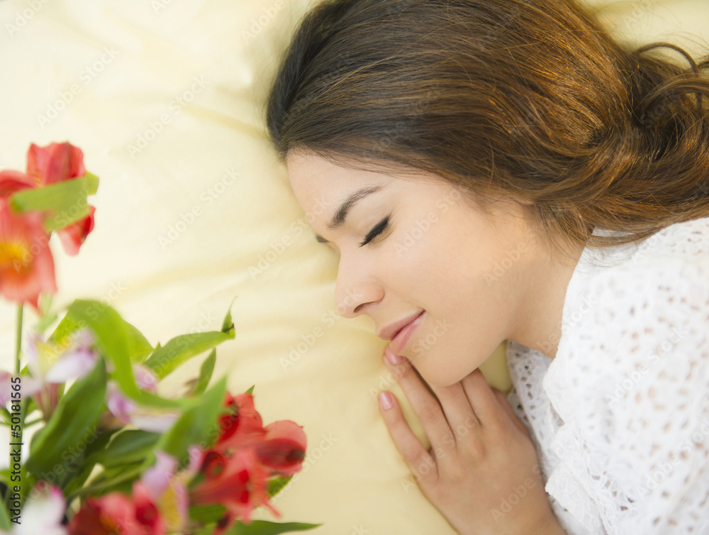 Hispanic woman sleeping in bed Hispanic woman sleeping in bed