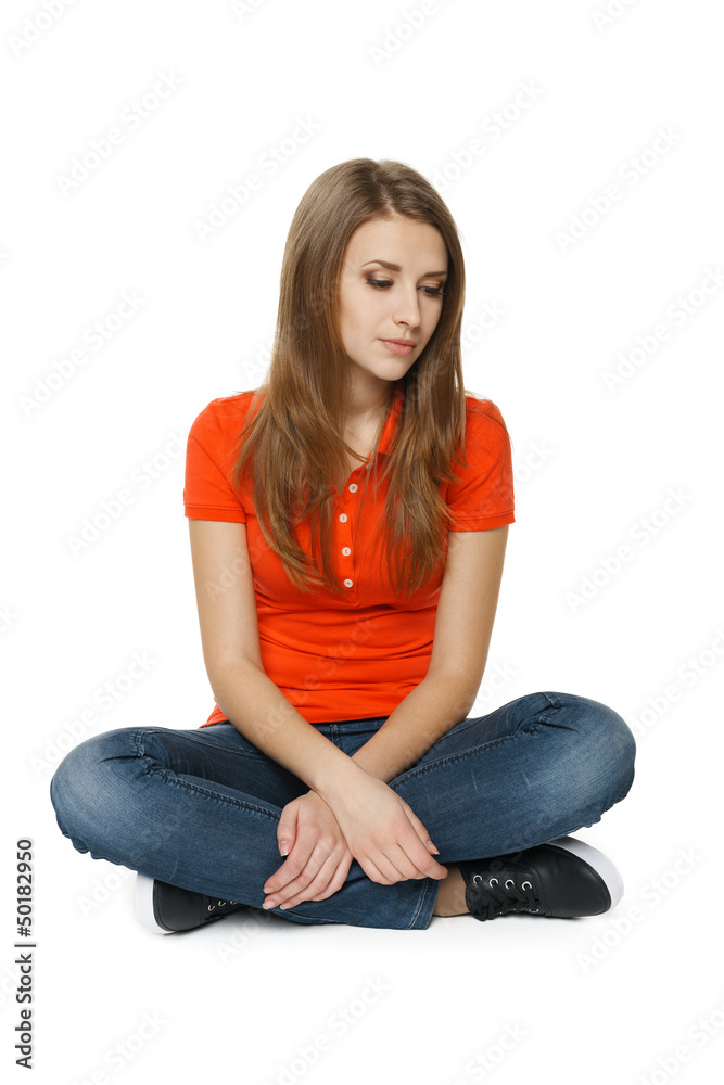 Woman is feeling sad while sitting on the floor Woman is feeling sad while sitting on the floor