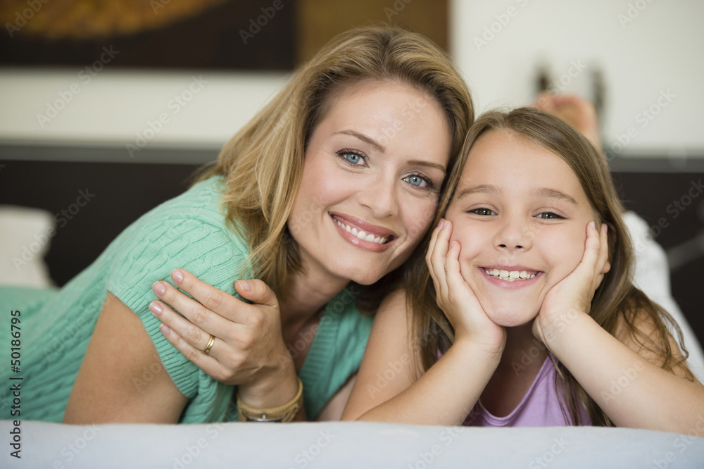 Smiling Hispanic mother and daughter Smiling Hispanic mother and daughter