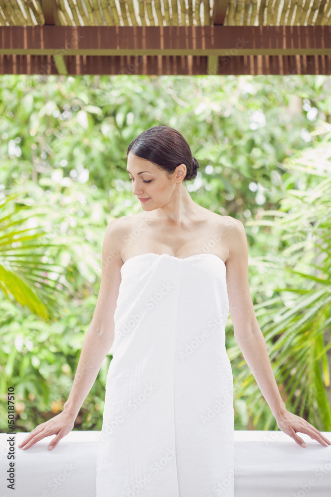 Caucasian woman in spa wrapped in a towel