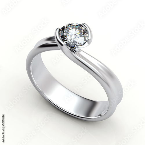 Wedding ring with diamond on white background. Sign of love