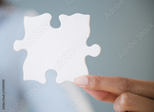 Cape Verdean woman holding puzzle piece
