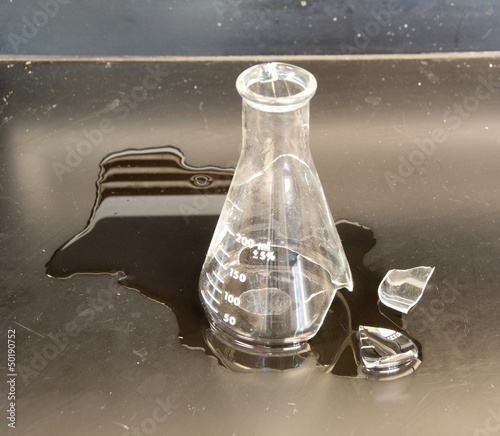 Broken flask on a lab bench