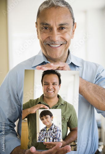 Portraits of Hispanic grandfather, father and son photo