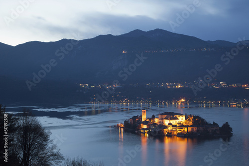 Illuminated island in Italian lake