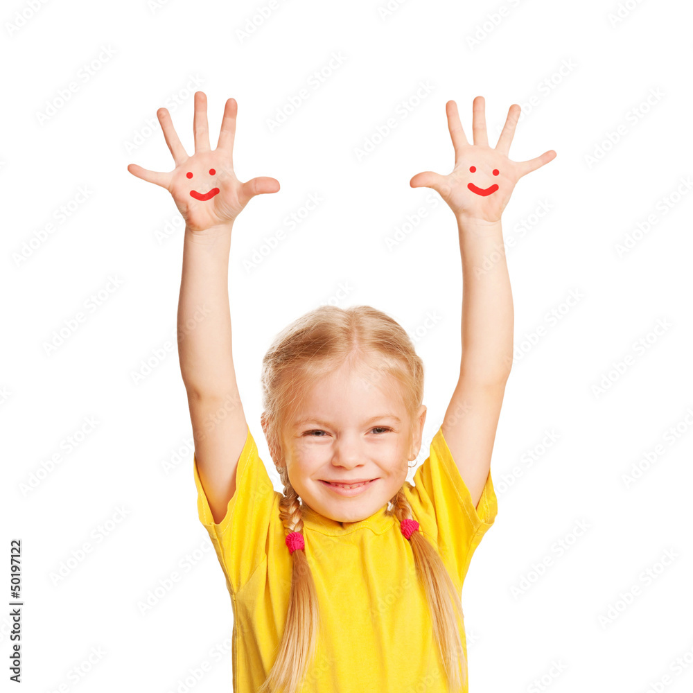 Happy little child with smiley faces painted on his palms. Happy little child with smiley faces painted on his palms.