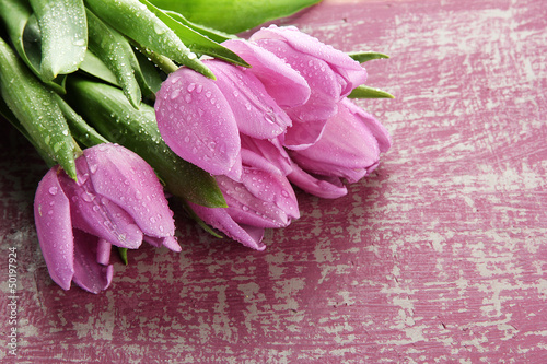 Fototapeta Naklejka Na Ścianę i Meble -  Beautiful bouquet of purple tulips on bright background