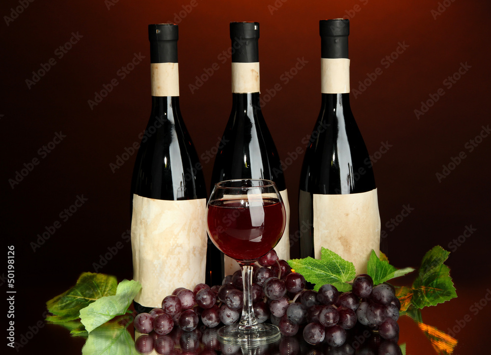 Composition of wine bottles, glass and  grape,