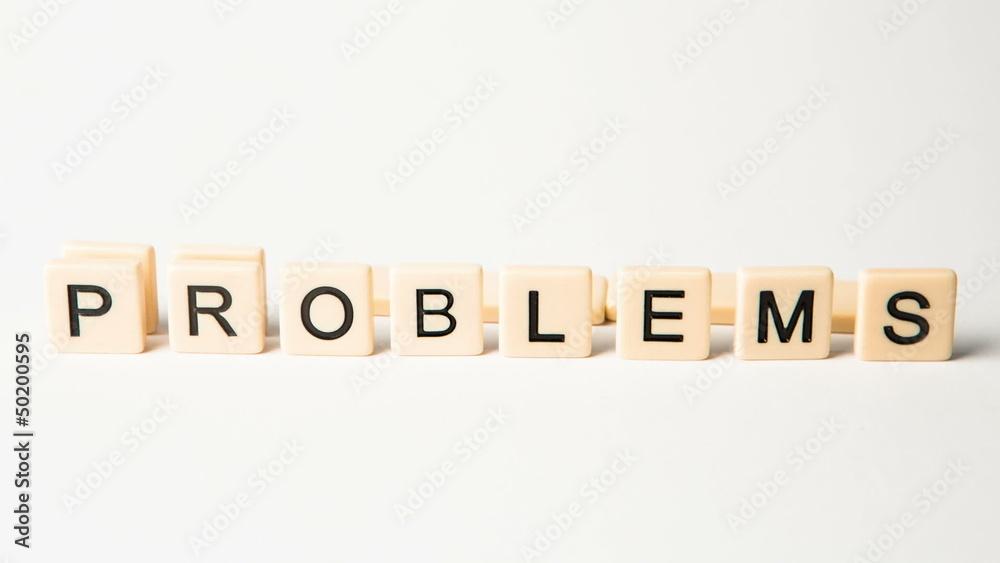 Letter pieces spelling solutions and problems standing up Letter pieces spelling solutions and problems standing up
