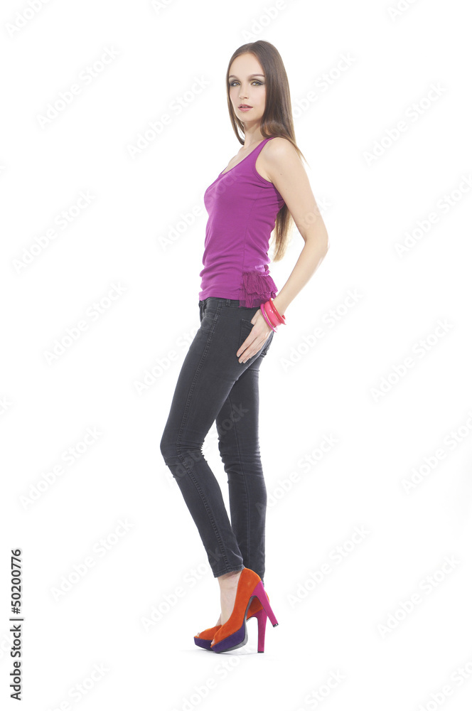 Full length The young long-haired girl in a vest posing Full length The young long-haired girl in a vest posing