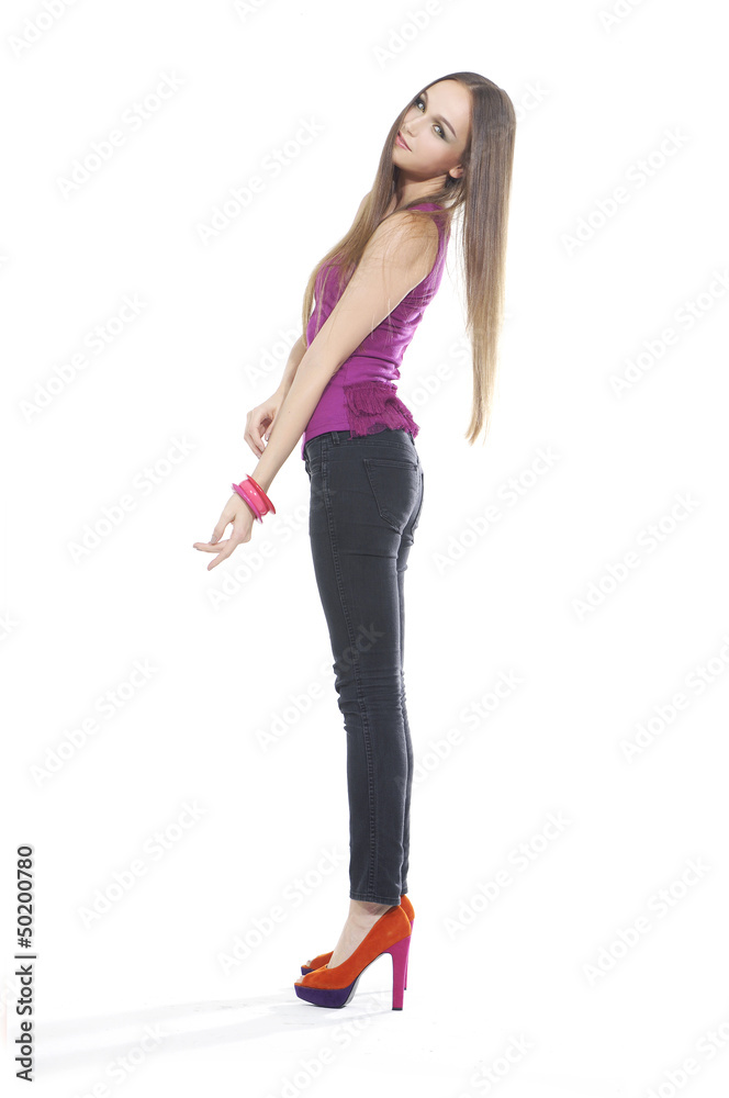 Fototapeta premium full-length young girl in vest posing in studio