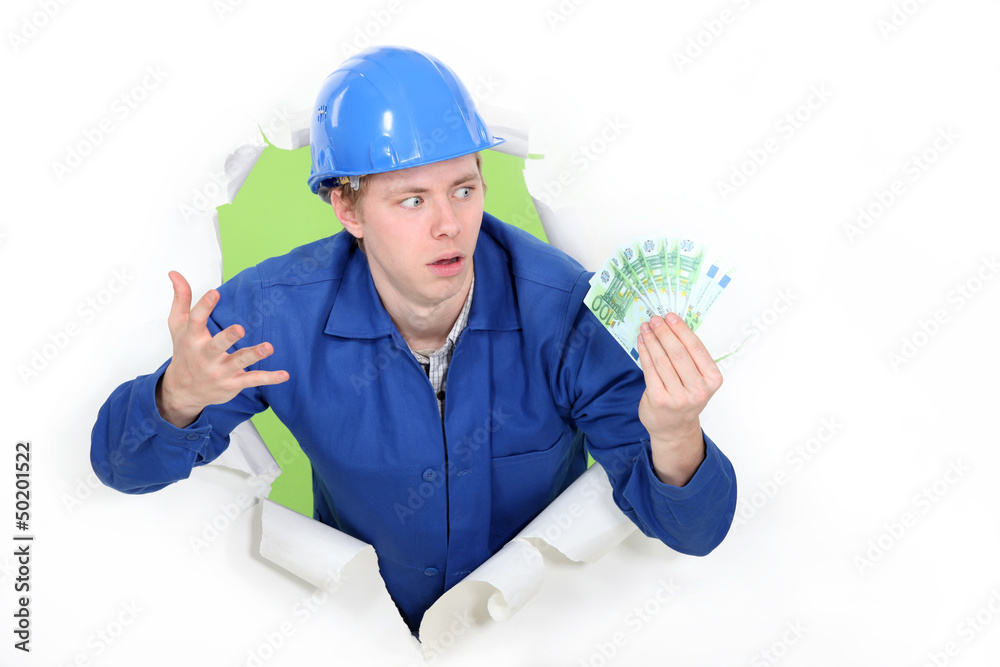 craftsman holding bills and looking surprised craftsman holding bills and looking surprised